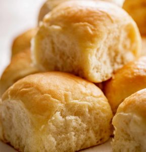 Freshly baked dinner rolls stacked